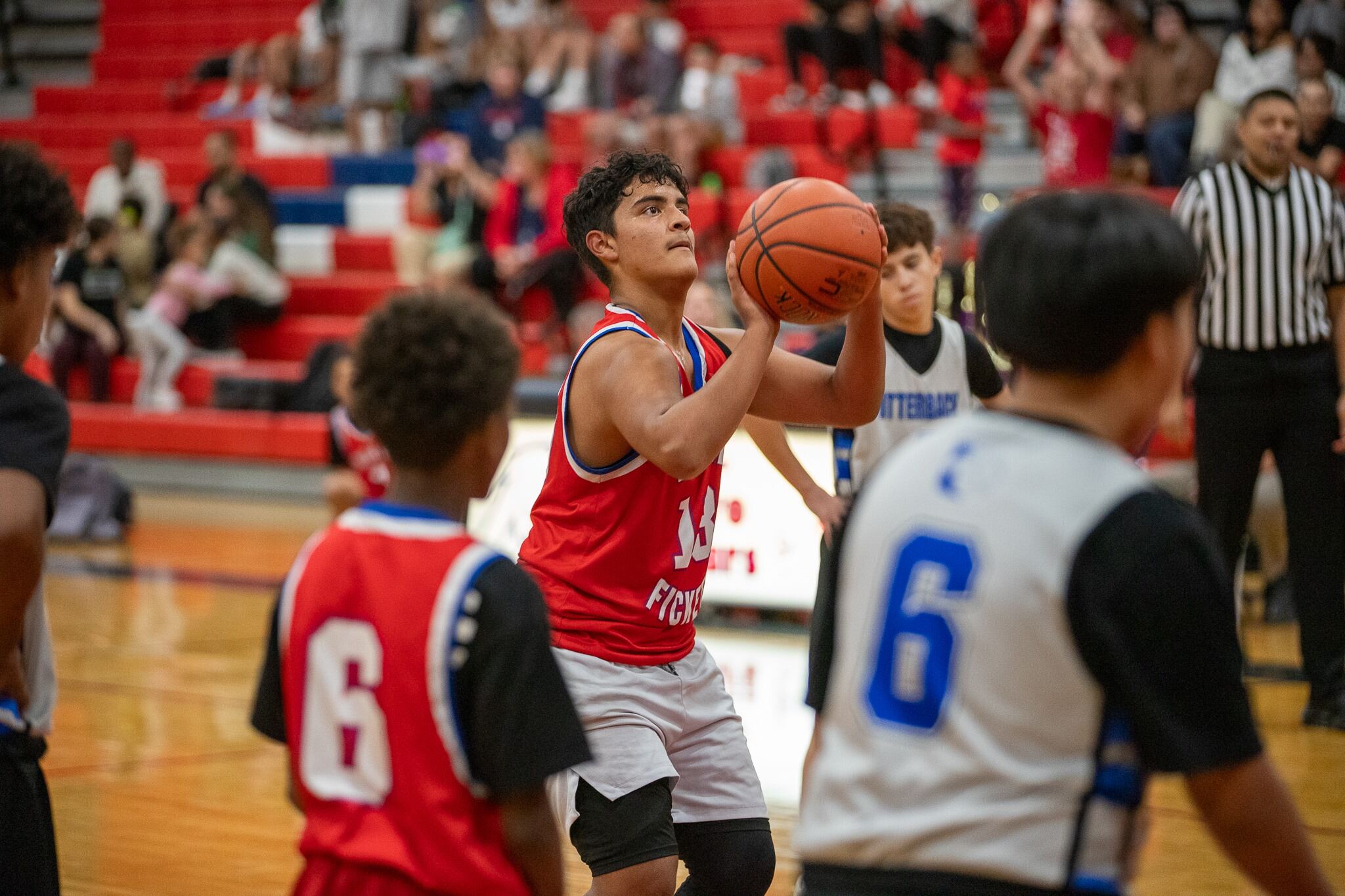 A Booth-Fickett player shoots the basketball