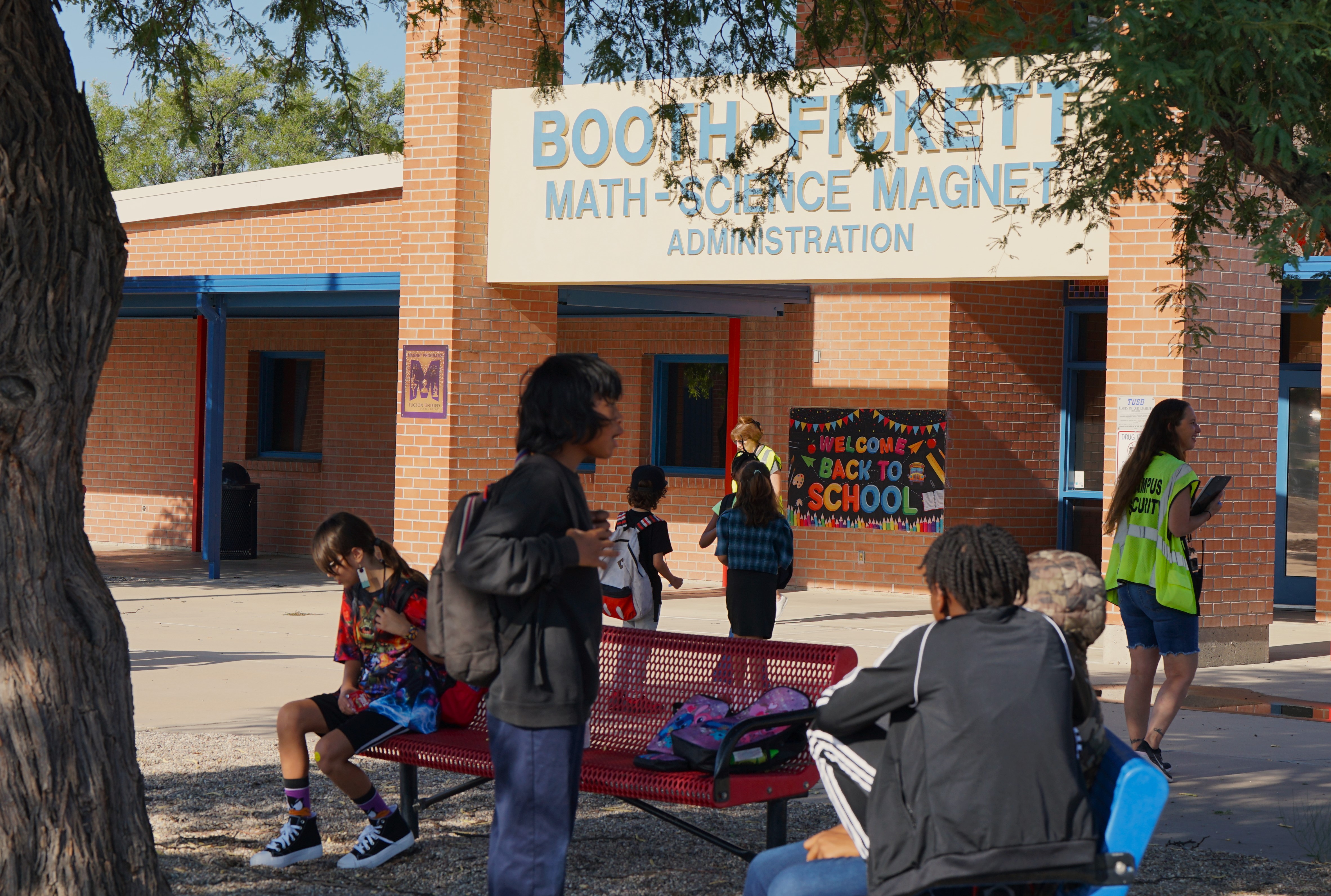 Students wait outside the building on the first day of school