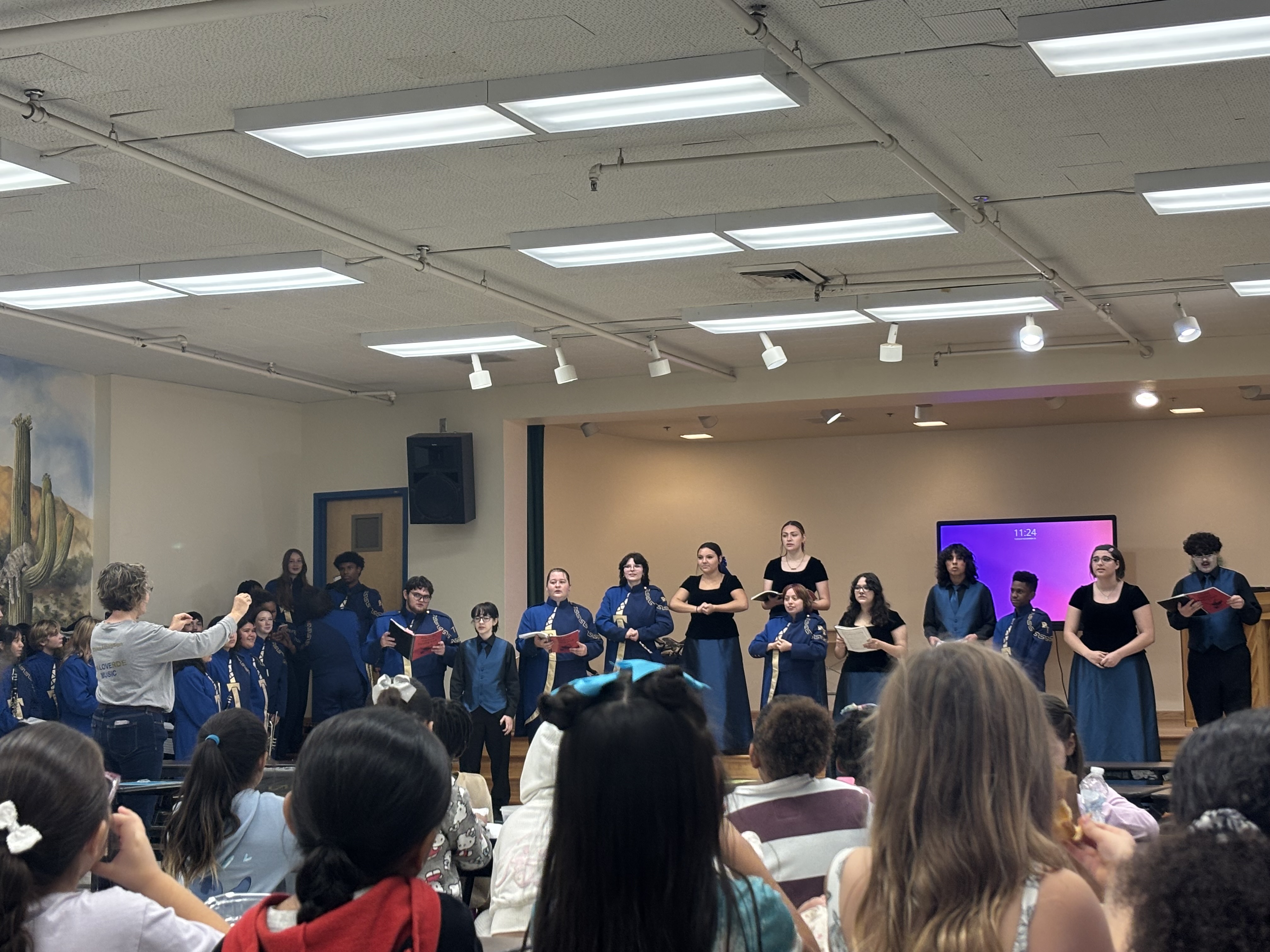 High school band performs for K-8 students