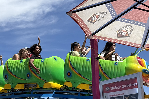 Students ride a caterpillar rollercoaster