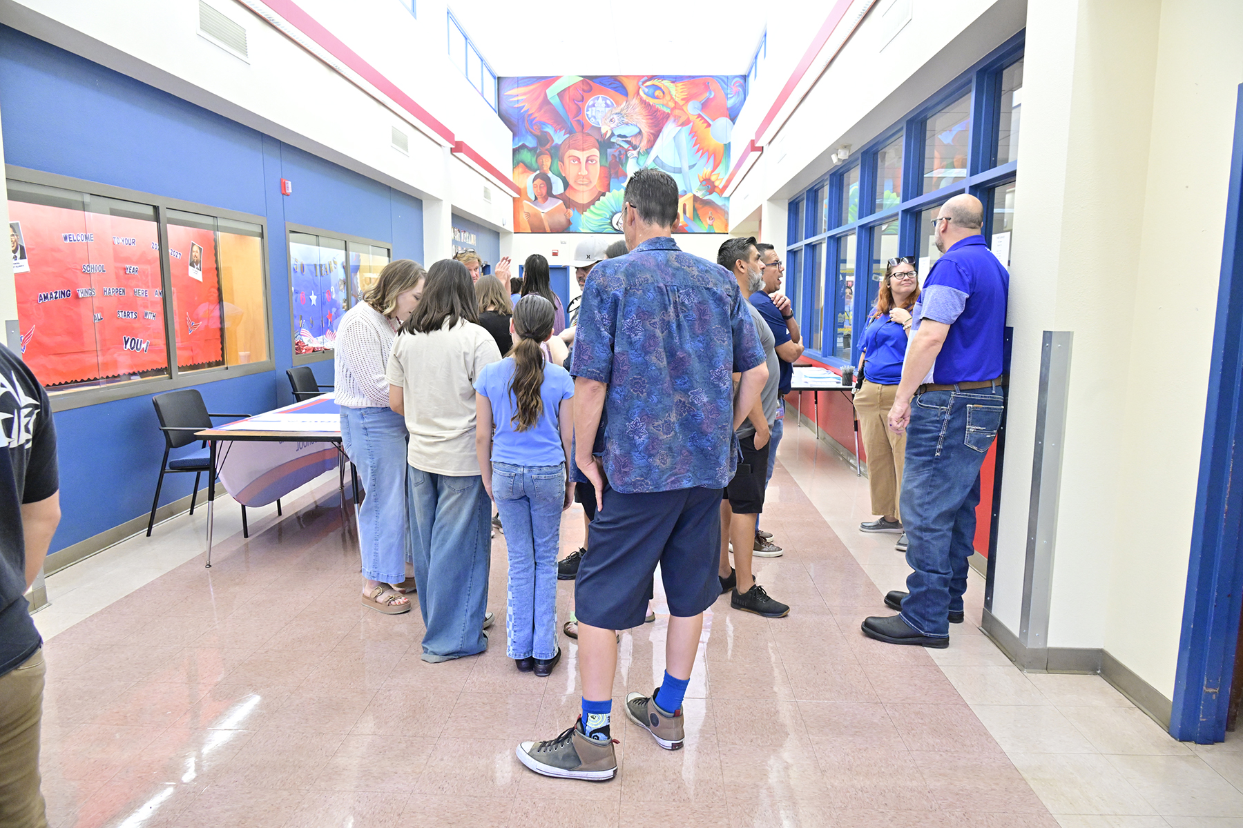 Families gather in the school hallway